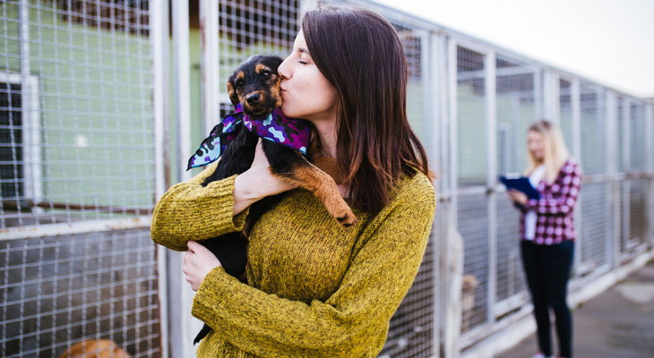 woman holding adopted dog